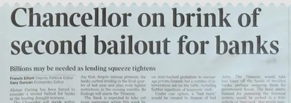 A close-up of The Times newspaper from January 3, 2009, featuring the headline Chancellor on brink of second bailout for banks. This iconic image is a staple of bitcoin nostalgia, representing Satoshi Nakamoto's message in the first block.